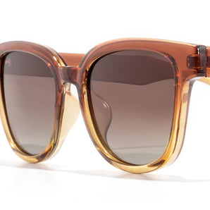 Miho sunglasses by Sunski in amber and brown with nature-inspired lenses, timeless curved frame ideal for beach and brunch wear