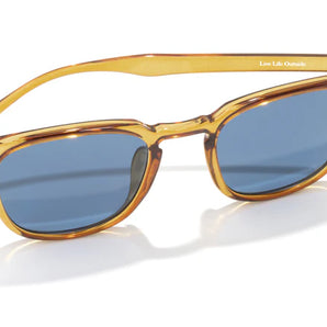 Tango by Sunski in translucent amber with blue polarized Helio lenses, superlight recycled frame, plastic-free, lifetime warranty sunglasses