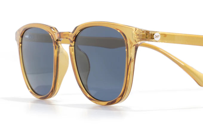 Tango by Sunski in translucent amber frame with polarized Helio lenses, SuperLight recycled sunglasses for men and women outdoor use