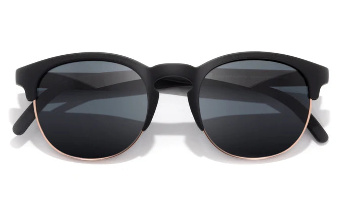 Avila by Sunski in black and gold half frame sunglasses with metal details and no wire nose pads for versatile everyday wear