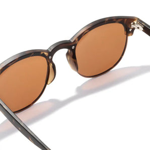 Avila by Sunski in tortoise with brown lenses, classic half frame glasses with metal details and lightweight design for men and women