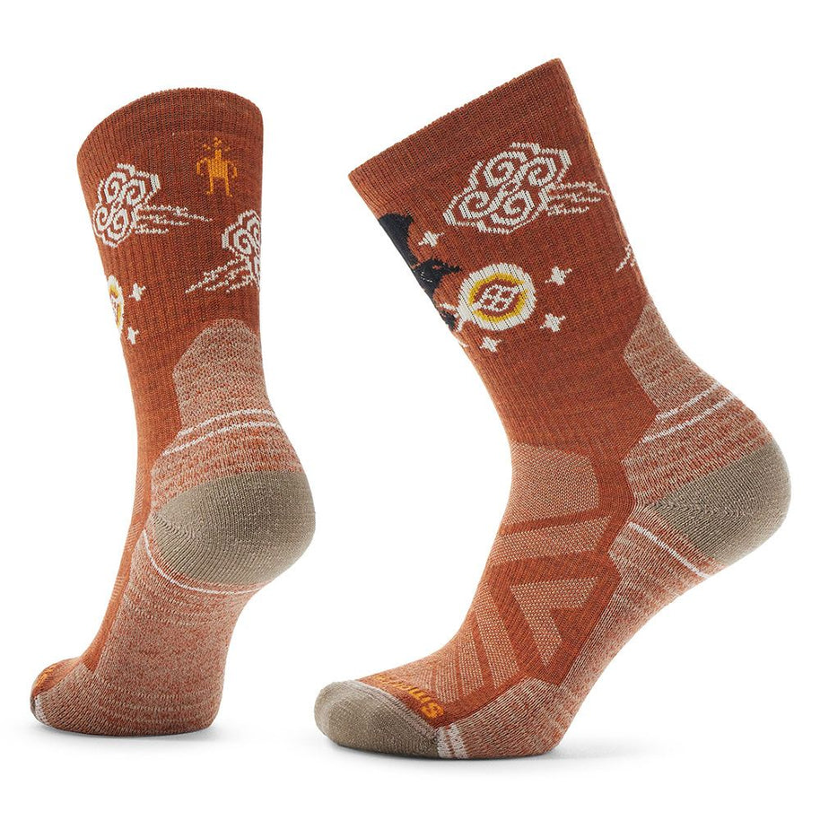 Hike Light Cushion Guardian Of The Skies Crew Socks - Women in rust and tan by SmartWool, cushioned over calf socks with original Indigenous print for snow days