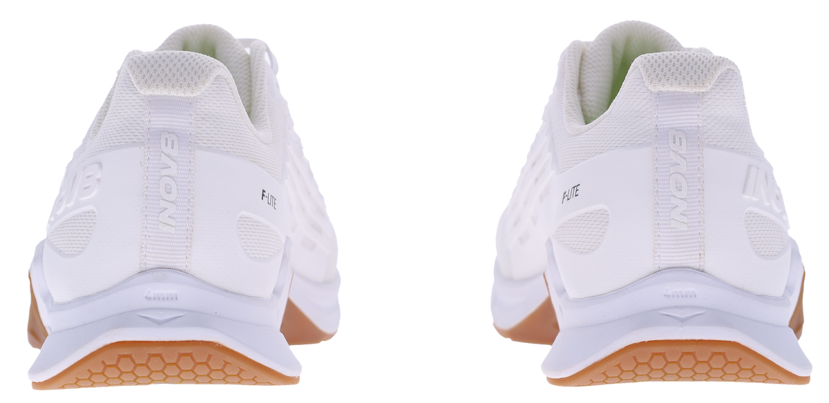 Back view of a pair of Inov8 F-Lite Wide women's training shoes in White/Gum with white heels and gum soles