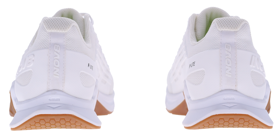 Back view of a pair of Inov8 F-Lite Wide women's training shoes in White/Gum with white heels and gum soles