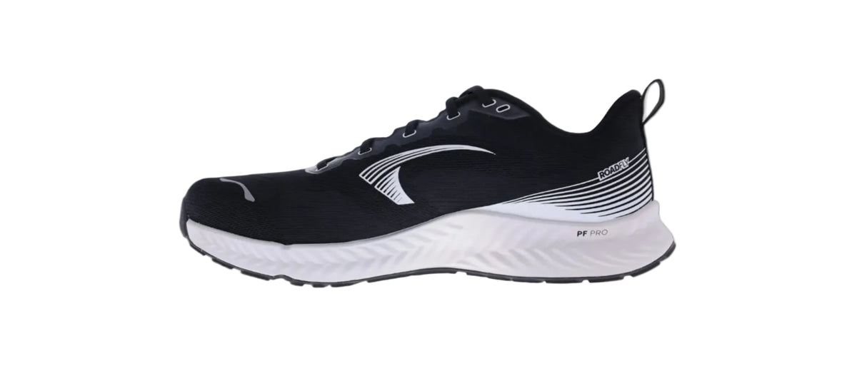 Inov8 RoadFly men's road running shoe in black with white midsole, inner side view