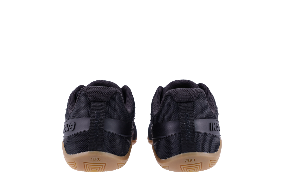 Pair of Inov8 Bare-XF V2 Wide women's training shoes in Black/Gum, back view of heels and gum soles