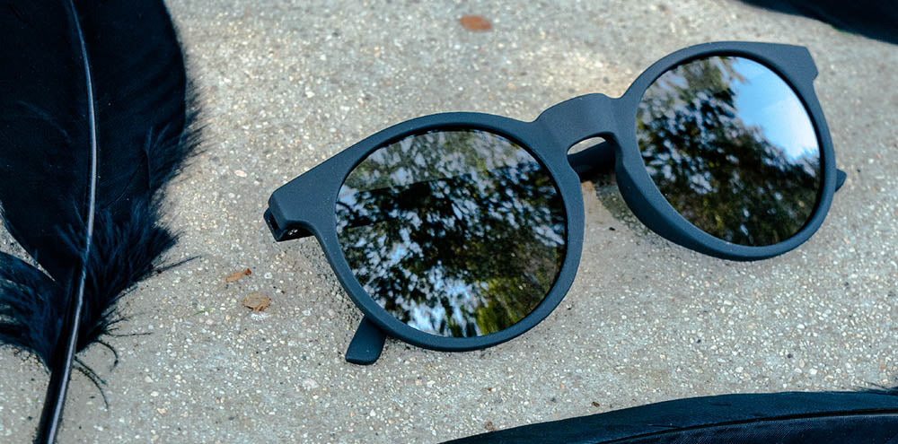 It's Not Black, It's Obsidian by Goodr, obsidian-colored glasses with reflective lenses, durable and stylish eyewear from USA-based brand
