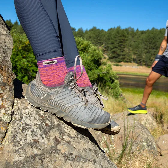 Trail Midweight Mini-Crew - Women by Injinji in purple and pink cushioned toe socks for running and hiking on uneven trails with support and agility