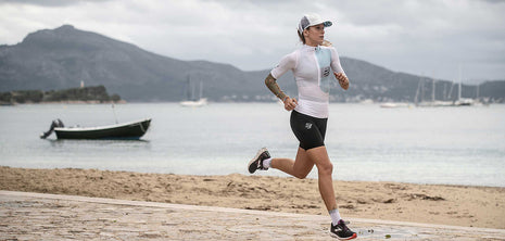Racing Trucker Cap by Compressport in white and grey, stylish lightweight headwear for high-performance running and outdoor training