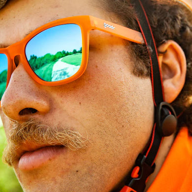 Donkey Goggles by Goodr in bright orange with reflective lenses, lightweight glasses for speed, agility, and outdoor use