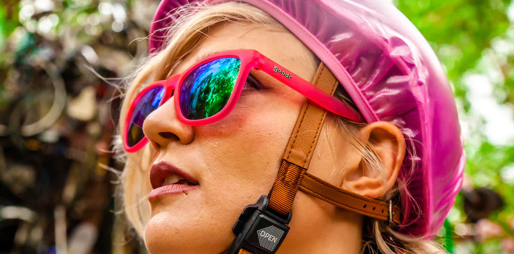 Flamingos On A Booze Cruise by Goodr in bright pink sunglasses with teal reflective lenses, lightweight glasses for running and outdoor use