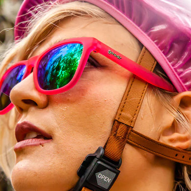 Flamingos On A Booze Cruise by Goodr in bright pink sunglasses with teal reflective lenses, lightweight glasses for running and outdoor use