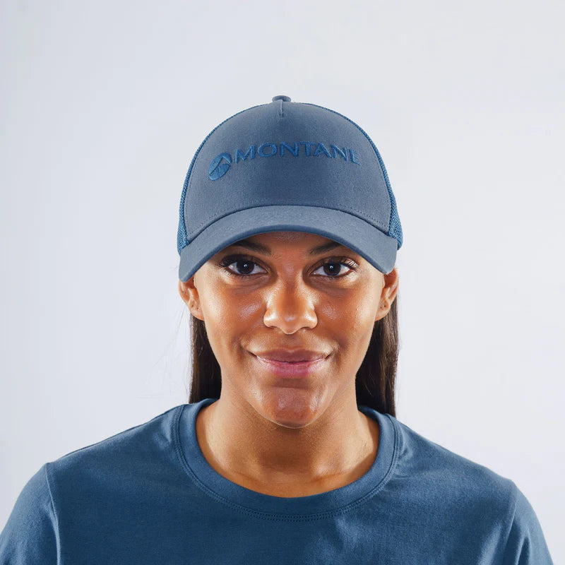 Basecamp Cap Unisex by Montane in blue cotton canvas with mesh back, rear hook and loop adjustment, COOLMAX headband for outdoor comfort
