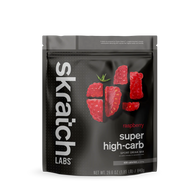 Super High-Carb Sport Drink Mix raspberry by Skratch Labs in black pouch, high-calorie nutrition for athletes needing fast energy fueling.