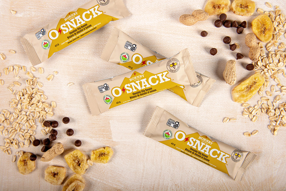 OSnack Chocolate Chip Banana by Hornby Organic in beige wrapper with peanut butter, banana, cinnamon, and dark chocolate chips, nutritious snack