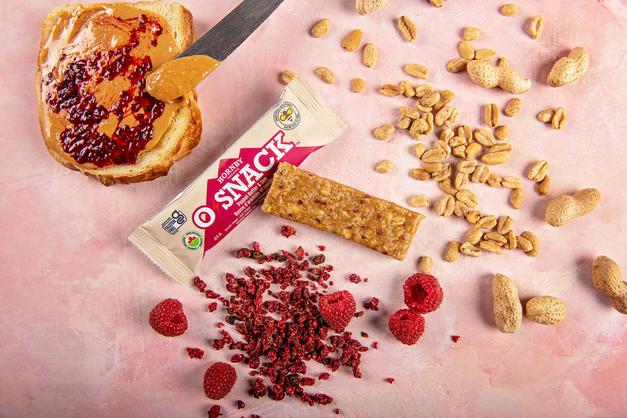 OSnack Peanut Butter & Jam by Hornby Organic in red and beige with organic peanut and raspberry flavour snack bar for nutrition and energy
