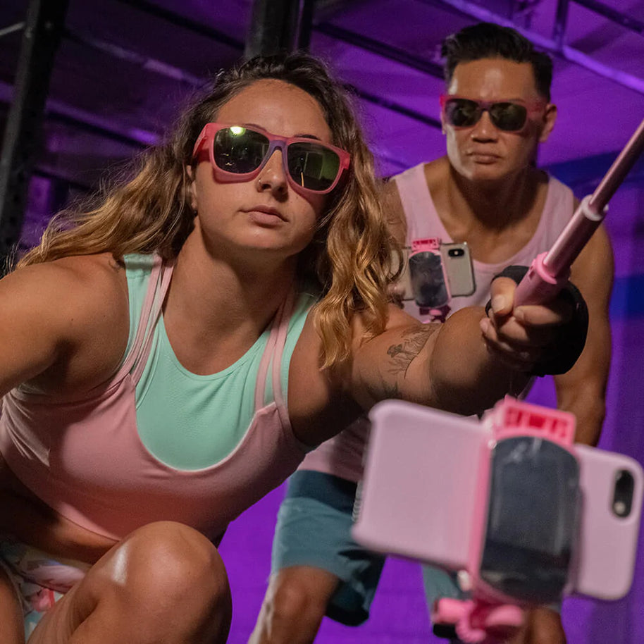 Do You Even Pistol, Flamingo? by Goodr pink frame glasses with teal polarized lenses for sweating during intense workouts and pistol training