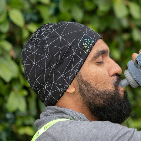 HyperNight Reflective Beanie by Nathan in black with reflective pattern, lightweight polyester stretch fabric for running day to night.