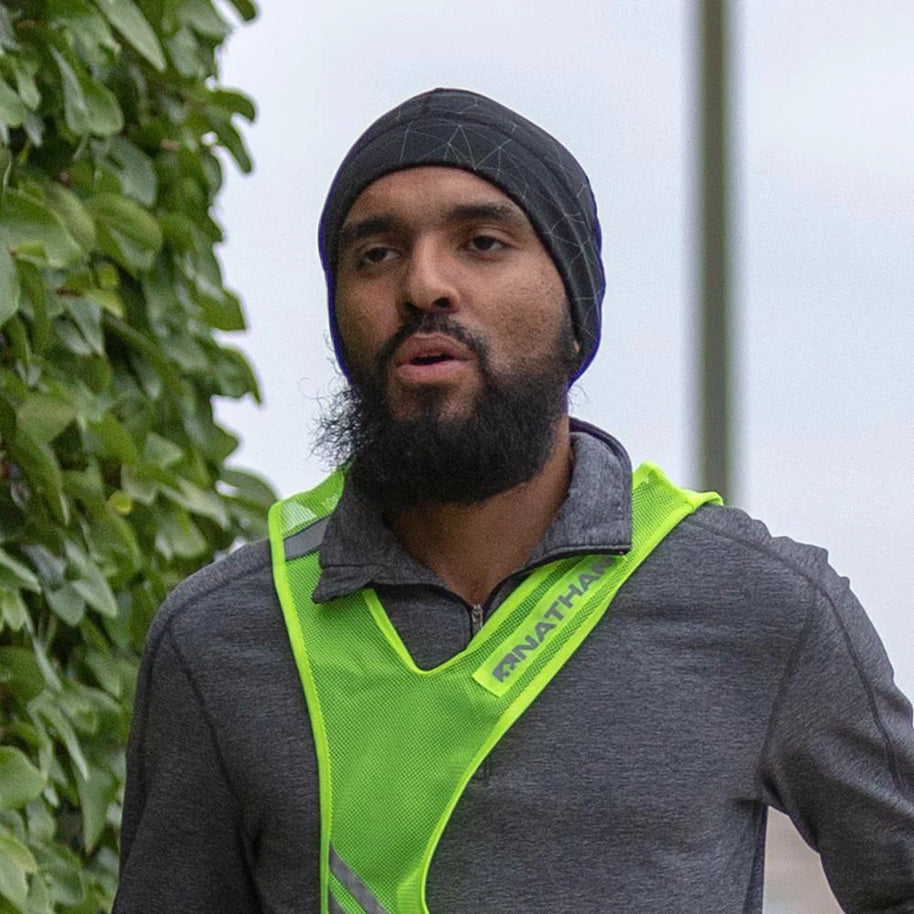 HyperNight Reflective Beanie by Nathan in black, lightweight stretch fit with reflective accents for cool weather running and safety.