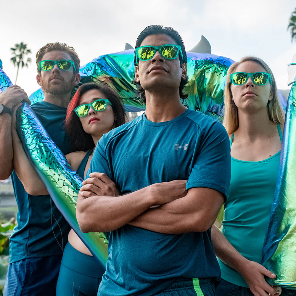 Nessy's Midnight Orgy by Goodr in teal, reflective sunglasses with Loch Ness Monster skin-inspired design for running and outdoor use