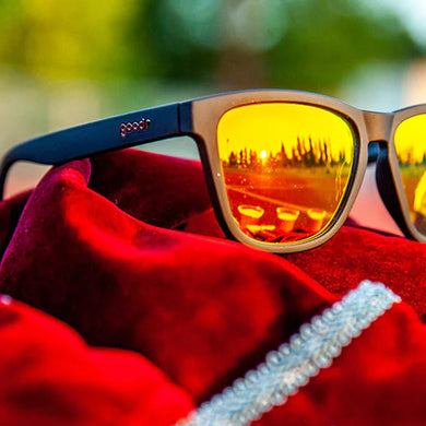 Whiskey Shots With Satan by Goodr in black and yellow reflective lenses, stylish lightweight glasses ideal for outdoor and running enthusiasts