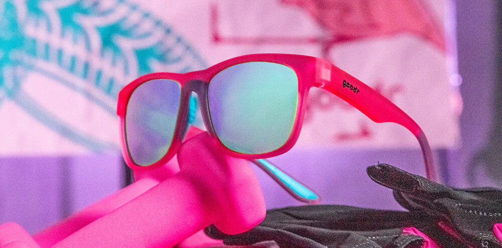 Do You Even Pistol, Flamingo? by Goodr pink frame glasses with teal polarized lenses, lightweight for outdoor pistol training and sweat resistance