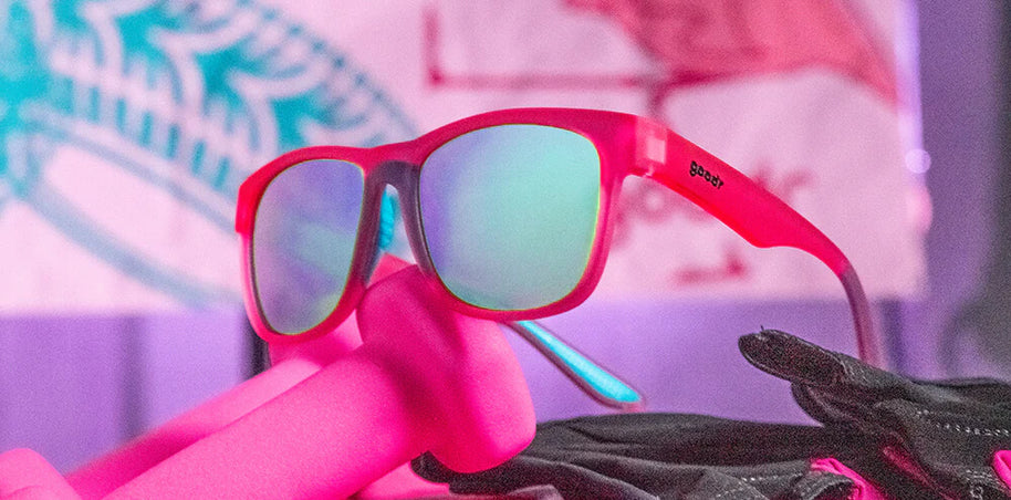 Do You Even Pistol, Flamingo? by Goodr pink frame glasses with teal polarized lenses, lightweight for outdoor pistol training and sweat resistance