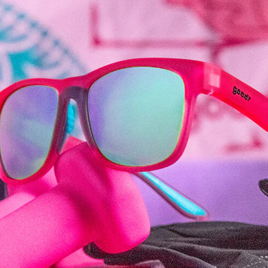 Do You Even Pistol, Flamingo? by Goodr pink frame glasses with teal polarized lenses, lightweight for outdoor pistol training and sweat resistance