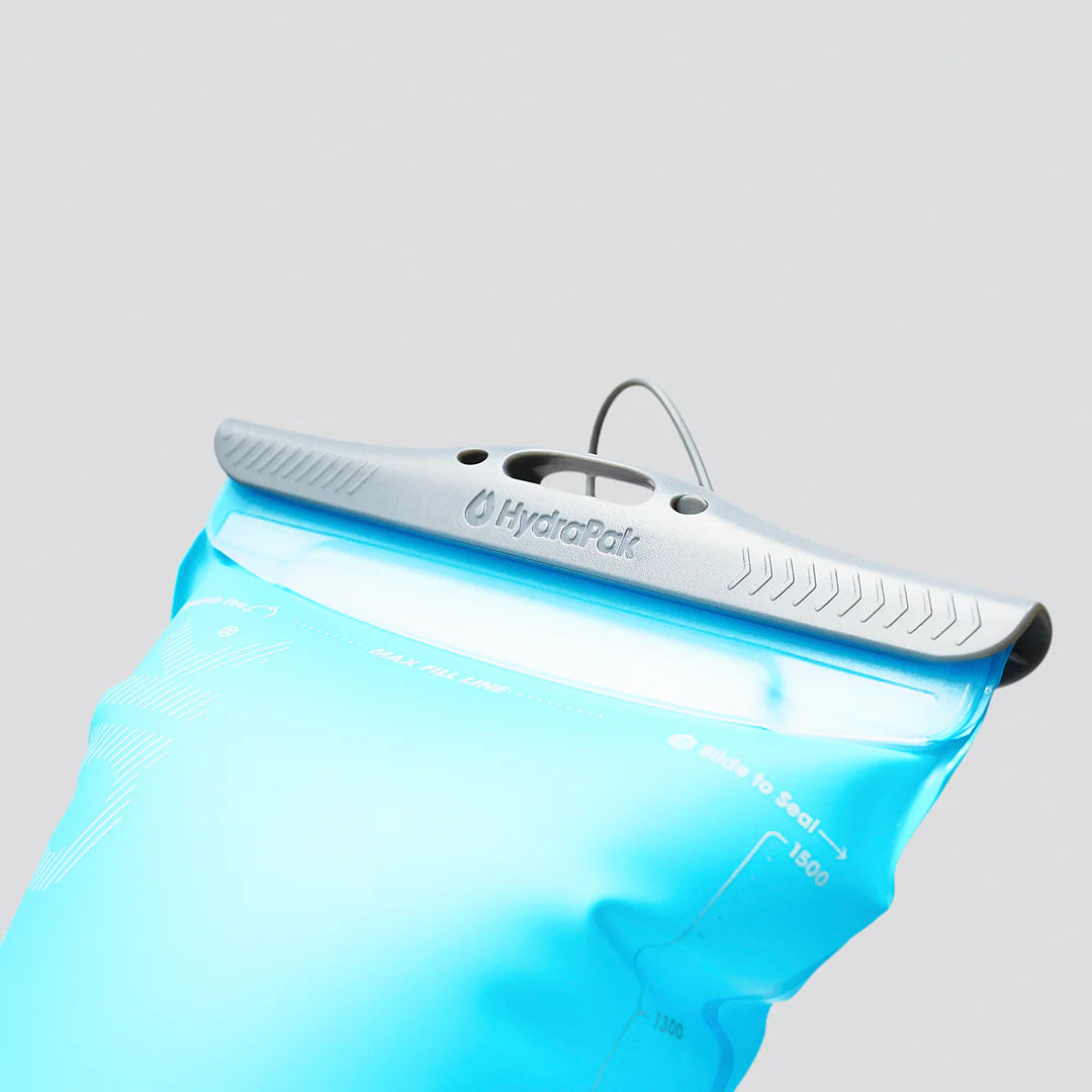 Velocity Reservoir by Hydrapak in light blue with ergonomic slide-seal top, lightweight 1.5L hydration reservoir designed for running and outdoor use.