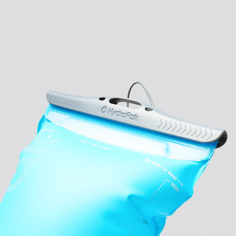 Velocity Reservoir by Hydrapak in light blue with ergonomic slide-seal top, lightweight 1.5L hydration reservoir designed for running and outdoor use.