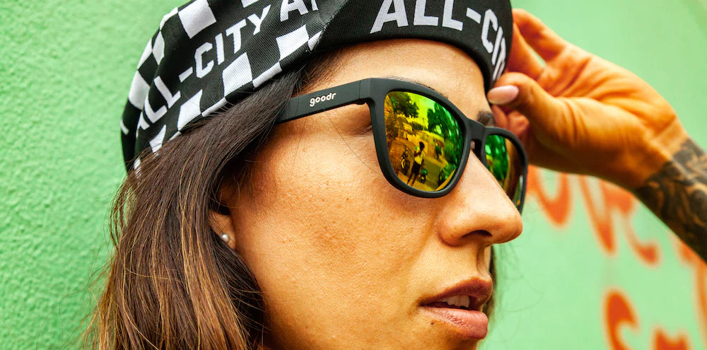 Whiskey Shots With Satan by Goodr in black and green reflective lenses, stylish sunglasses designed for outdoor use and urban running