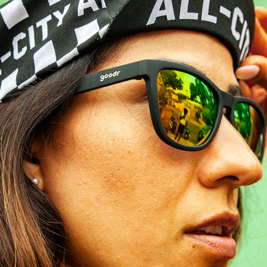 Whiskey Shots With Satan by Goodr in black and green reflective lenses, stylish sunglasses designed for outdoor use and urban running