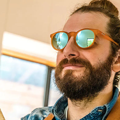 Freshly Baked Man Buns by Goodr, amber frame sunglasses worn by man with tied hair bun and beard, USA-based style for everyday use
